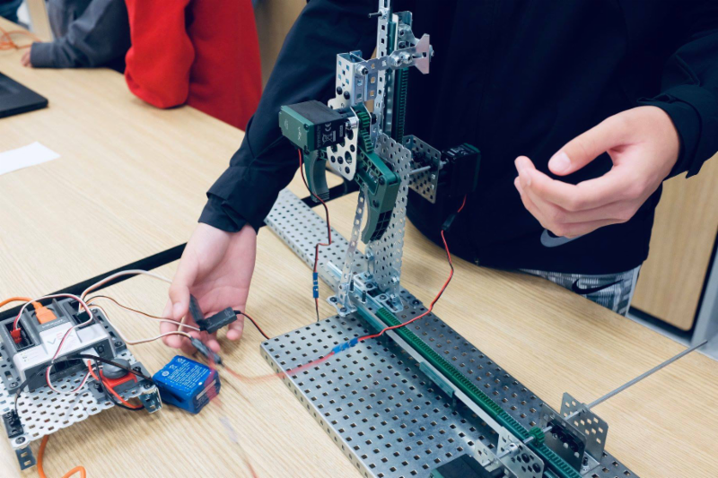 Students have a wonderful time showcasing their robotics projects to parents, peers, and staff.