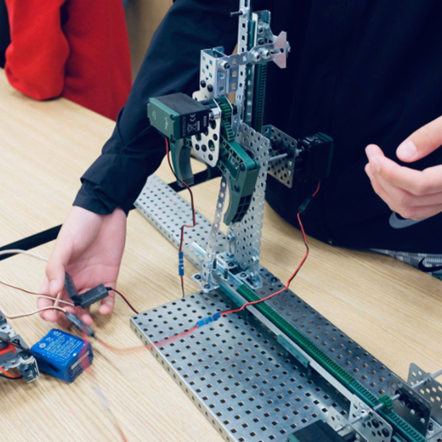 Students have a wonderful time showcasing their robotics projects to parents, peers, and staff.